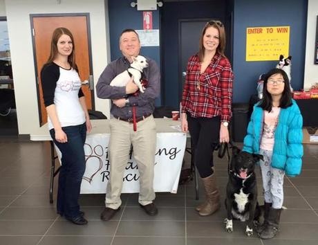 Bethany and Donna with Two Dogs Receiving a Generous Donation by Subaru of Moncton